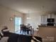A bright dining area features a table with seating for six and sliding glass doors to the backyard at 1953 Boulder Ct, Gastonia, NC 28054