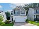 Charming two-story home with a well-manicured lawn, a two-car garage, and beautiful curb appeal at 1953 Boulder Ct, Gastonia, NC 28054