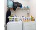 Laundry room with washer, dryer, and shelving unit at 1953 Boulder Ct, Gastonia, NC 28054