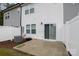 A view of the backyard featuring a patio, white fence, and modern exterior at 2004 Crooked Oak Ln, York, SC 29745