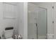 Bathroom featuring a glass shower, white cabinets, and tile flooring at 2004 Crooked Oak Ln, York, SC 29745