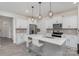 Modern kitchen with white cabinets, stainless steel appliances, and a gray island with white countertop at 2004 Crooked Oak Ln, York, SC 29745