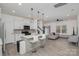 Open-concept living space with kitchen island, modern appliances, and cozy seating area at 2004 Crooked Oak Ln, York, SC 29745