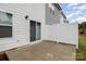 A closer view of the concrete patio, white fencing, and exterior features at 2004 Crooked Oak Ln, York, SC 29745
