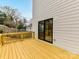 Back deck features wood railings, access from the home, and an extension of the outdoor living space at 2615 Brentwood Pl, Charlotte, NC 28208