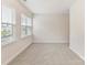 A well-lit bedroom with neutral carpet flooring and windows, offers ample natural light at 2615 Brentwood Pl, Charlotte, NC 28208