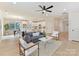 Open-concept living space with modern furniture flowing into the kitchen and dining areas at 2615 Brentwood Pl, Charlotte, NC 28208