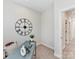 A cozy office space featuring a desk, an accent clock and natural light at 2615 Brentwood Pl, Charlotte, NC 28208