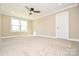 Bedroom featuring neutral walls, carpet flooring, and a window for bright natural light at 2622 Old Camden Rd, Monroe, NC 28110