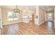 Open floorplan with a bright dining space with an island, stainless steel appliances, and granite countertops at 2622 Old Camden Rd, Monroe, NC 28110