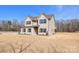 Side view of the home showing the brick facade and low maintenance vinyl siding at 2622 Old Camden Rd, Monroe, NC 28110