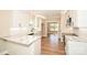 Beautiful kitchen with an island, white cabinets, granite countertops, and stainless steel appliances at 2622 Old Camden Rd, Monroe, NC 28110