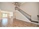 Spacious living room flows into kitchen with a staircase, creating an open and airy atmosphere at 2622 Old Camden Rd, Monroe, NC 28110