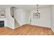 Bright dining area with hardwood floors and a modern chandelier at 2944 Caldwell Ridge Pkwy, Charlotte, NC 28213