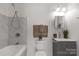 Updated bathroom with a shower-tub combination and modern vanity with elegant fixtures at 305 Flat Rock St, Clover, SC 29710