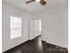 Bright bedroom features wood-look flooring and a ceiling fan at 305 Flat Rock St, Clover, SC 29710