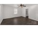 This bedroom is big with wood look flooring and a ceiling fan at 305 Flat Rock St, Clover, SC 29710
