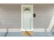 A bright white front door with a welcoming doormat at 305 Flat Rock St, Clover, SC 29710