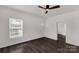 Cozy living room features white walls, wood-look flooring and a ceiling fan at 305 Flat Rock St, Clover, SC 29710