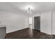 Open living room with modern ceiling fan and wood-look flooring at 305 Flat Rock St, Clover, SC 29710