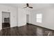 Bright living room with dark wood floors, white walls, and natural light at 305 Flat Rock St, Clover, SC 29710