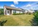 Well-maintained backyard featuring a spacious lawn and neatly trimmed hedges, perfect for outdoor activities at 333 Dudley Dr, Fort Mill, SC 29715