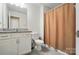Cozy bathroom with granite countertop vanity and shower featuring a patterned curtain at 333 Dudley Dr, Fort Mill, SC 29715