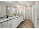 Bright bathroom with double vanity, granite countertops, and herringbone flooring at 333 Dudley Dr, Fort Mill, SC 29715
