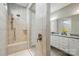 Bright bathroom featuring a tiled shower with a glass door and a vanity with granite counters at 333 Dudley Dr, Fort Mill, SC 29715