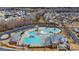 Aerial view of a community pool featuring a large pool, a kiddie pool, a slide, and a seating area at 333 Dudley Dr, Fort Mill, SC 29715