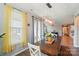 Dining area featuring hardwood floors, a wooden table, and views of the living room at 333 Dudley Dr, Fort Mill, SC 29715