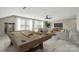 Spacious game room with a pool table, comfortable seating, and natural light from large windows at 333 Dudley Dr, Fort Mill, SC 29715