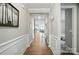 Inviting hallway with wood floors and white wainscoting, leading to the living spaces at 333 Dudley Dr, Fort Mill, SC 29715