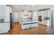 Spacious kitchen with white cabinetry, granite countertops, and a central island with seating at 333 Dudley Dr, Fort Mill, SC 29715