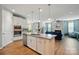 Open kitchen with granite island, stainless appliances, and seamless flow to the living room at 333 Dudley Dr, Fort Mill, SC 29715