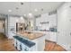 Open-concept kitchen featuring granite countertops, stainless steel appliances, and a large island with seating at 333 Dudley Dr, Fort Mill, SC 29715