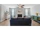 Cozy living room with a fireplace, large windows, and blue curtains at 333 Dudley Dr, Fort Mill, SC 29715