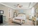 Spacious main bedroom with tray ceiling, carpet floors, and a view of the ensuite bathroom at 333 Dudley Dr, Fort Mill, SC 29715