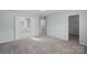 A spacious carpeted bedroom with walk-in closet and an ensuite bathroom featuring double doors at 3439 Duchess Ave, Fort Mill, SC 29707