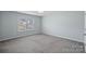 A well lit bedroom with a window and neutral colors at 3439 Duchess Ave, Fort Mill, SC 29707
