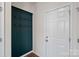 Entryway with built-in coat rack and a white door at 3439 Duchess Ave, Fort Mill, SC 29707