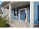 A blue front door, white columns, and black shutters welcome visitors to this home at 3439 Duchess Ave, Fort Mill, SC 29707