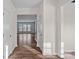 Bright hallway with hardwood flooring leads to a living space with large windows at 3439 Duchess Ave, Fort Mill, SC 29707