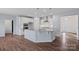 Modern kitchen featuring a large center island with granite countertops and stainless steel appliances at 3439 Duchess Ave, Fort Mill, SC 29707