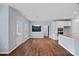Open-concept kitchen and dining area with hardwood floors and white cabinets at 3439 Duchess Ave, Fort Mill, SC 29707