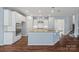 Spacious kitchen with stainless steel appliances, an island, and a tile backsplash at 3439 Duchess Ave, Fort Mill, SC 29707