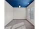 Empty carpeted room has a blue ceiling, neutral walls, and a large window at 3439 Duchess Ave, Fort Mill, SC 29707