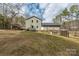 Backyard view of home and deck, showing spacious green yard and home's siding at 360 Patience Dr, Concord, NC 28025