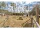 A backyard barn and fenced pasture create an inviting space at 360 Patience Dr, Concord, NC 28025