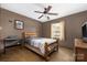 This cozy bedroom features wood trim, a ceiling fan, and ample natural light at 360 Patience Dr, Concord, NC 28025